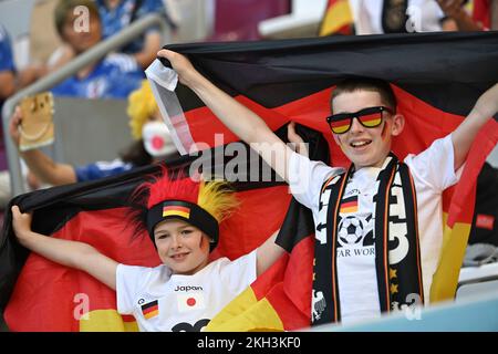 Doha, Katar. 23rd Nov, 2022. German fans, soccer fans, two boys, children. Germany (GER) - Japan (JPN) 1-2 Group Stage Group E on 23.11.2022 at Khalifa International Stadium. Soccer World Cup 2022 in Qatar from 20.11. - 18.12.2022 ? Credit: dpa/Alamy Live News Stock Photo