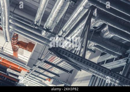 Heating, Ventilation and Air Conditioning System Installation. Commercial Building HVAC Ducts Pipeline. Temperature Control Technology. Stock Photo