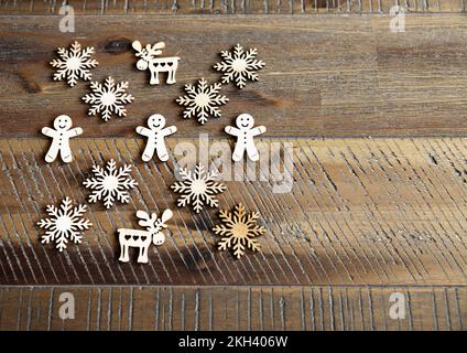 Little Santa stands next to an Armenian wooden Christmas tree toy