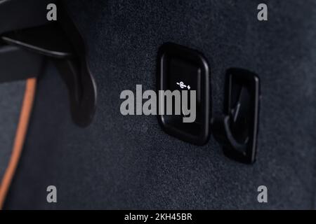 12V power outlet socket in the car. Closed socket in car. Stock Photo