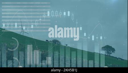 Image of wind turbines moving in countryside and stock exchange graph increasing and decreasing Stock Photo