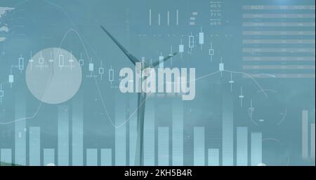 Image of wind turbines moving in countryside and stock exchange graph increasing and decreasing Stock Photo