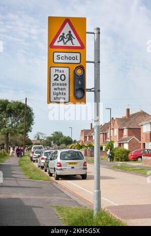 20 mph restrictrion sign on school residential street in West Sussex, England Stock Photo