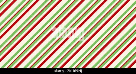 Red and green vintage rough kraft textured seamless diagonal candy cane stripes Christmas decoration pattern. Classic xmas card background or gift wra Stock Photo