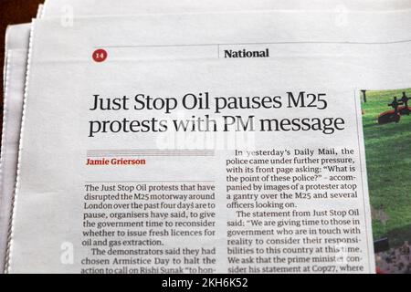 'Just Stop Oil pauses M25 protests with PM message'  Guardian newspaper headline climate crisis protests article 12 November 2022 London UK Stock Photo