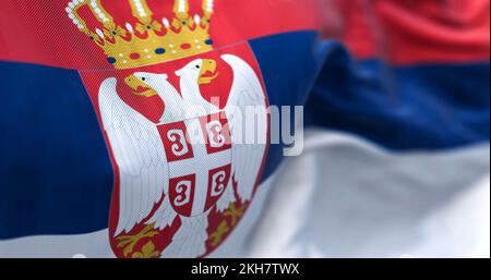 Close-up view of the Serbia national flag waving in the wind. The Republic of Serbia is a State of Southeast Europe. Fabric textured background. Selec Stock Photo