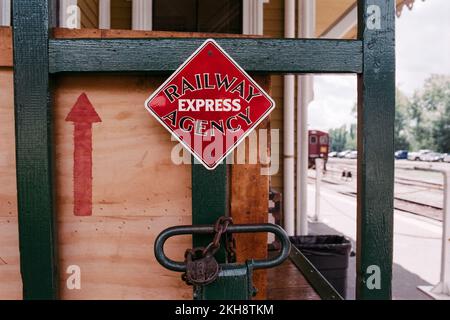 Vintage crates and bagage staked outside the Conway Scenic Railway station. North Conway, New Hampshire. Image captured on analog film. Stock Photo