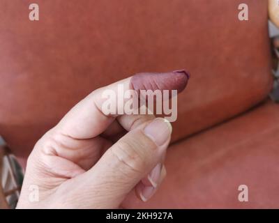 electoral purple ink stain mark on the index finger Stock Photo