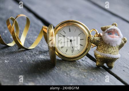 Christmas is coming soon card. Santa claus and pocket watch. Stock Photo