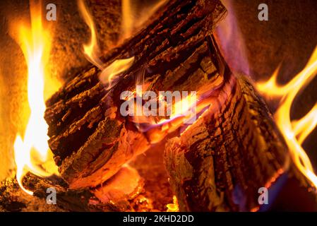Burning log in the fireplace, firewood, open fire, fireplace, glowing charcoal, heat, fire, embers, smoke, fine dust, Germany, Europe Stock Photo