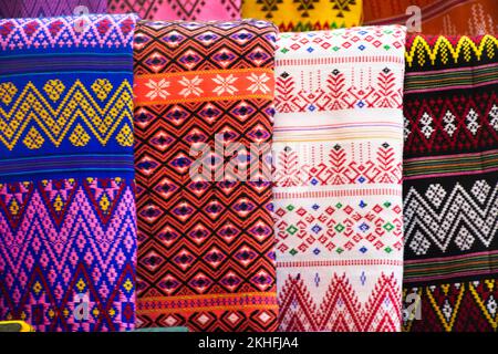 Material karen ethnic fabric and raw hand woven cotton ancient pattern and antique design texture for show and sale in oh poi street local market  baz Stock Photo