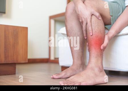 Man having leg pain due to calf muscle cramped and Shin Splints ache. injuries, health and medical concept Stock Photo