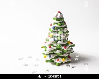 Green cookie christmas tree made by star cookie cutter on white background Stock Photo