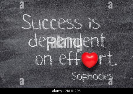 Success is dependent on effort - quote of ancient Greek philosopher Sophocles written on chalkboard with red heart symbol instead of O Stock Photo
