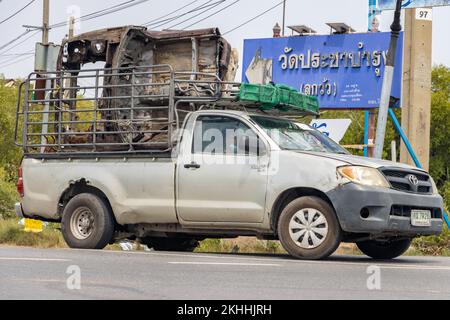 BANGKOK, THAILAND, JUNE 01 2022, The pickup is carrying a part from an old car Stock Photo