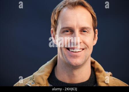 He has every reason to smile. A cropped studio portrait of a handsome man. Stock Photo