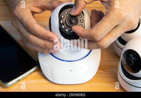 Conceptual man operating ip camera Stock Photo
