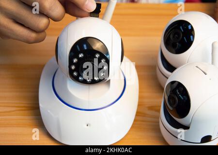 Conceptual man operating ip camera Stock Photo