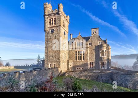 Carbisdale Castle Invershin Scotland blue sky and early morning mist over the Kyle of Sutherland Stock Photo