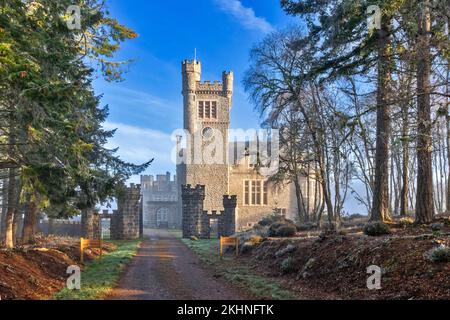 Carbisdale Castle Invershin Scotland early morning mist over the clock tower and building Stock Photo