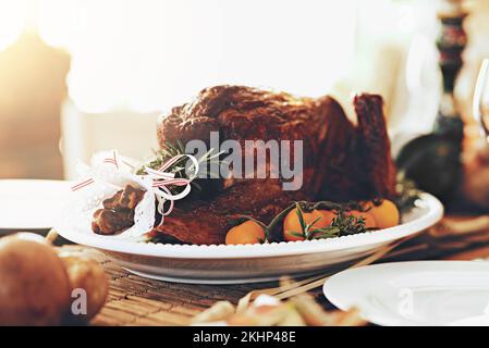 Turkey, chicken and food for thanksgiving, christmas and family lunch, dinner table setting and party, celebration and cooking in home. Background Stock Photo