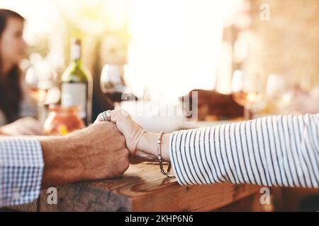 Family hands and praying at lunch for worship at table for thanksgiving, family lunch or gathering in a home. Food, pray and hand of people praying Stock Photo