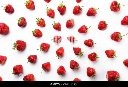 Red juicy strawberries laid out on a white background aesthetically pleasing photo Stock Photo