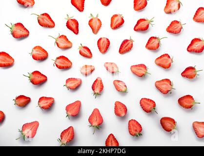 Red juicy strawberry in a cut laid out on a white background aesthetically pleasing. High quality photo Stock Photo