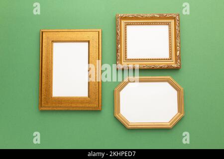 Gold frame on green background with place for your text. High quality photo Stock Photo