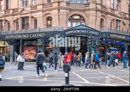 People out and about pass by The Hippodrome Casino, a 24/7 casino on Cranbourn Street providing live gaming, entertainment, bars. London, England, UK Stock Photo