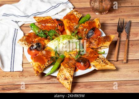 Wrapped Doner Kebab. Special kebab prepared with tomato and butter. local name beyti doner Stock Photo