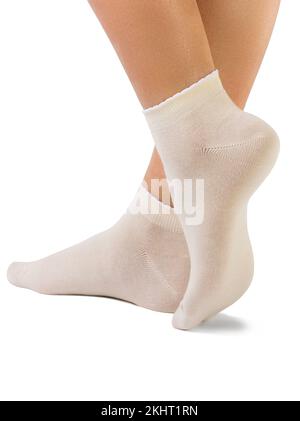 Side view of beautiful woman foot dressed in new nice and soft natural cotton fabric blank beige socks Stock Photo