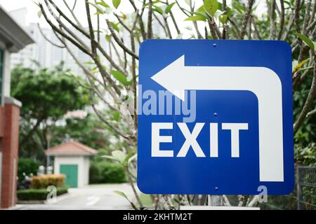 exit sign on brick wall  Stock Photo