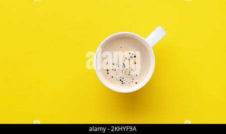 Espresso coffee on yellow background. Flat lay with copy space Stock Photo