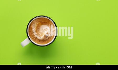 Espresso coffee on green background. Flat lay with copy space Stock Photo