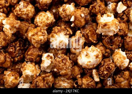 Caramel candy popcorn background. Scattered popcorn texture background Stock Photo