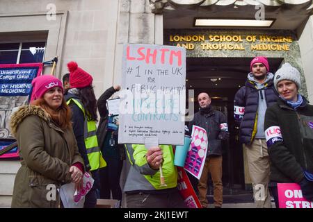 London, UK. 24th Nov, 2022. A University and College Union (UCU) member holds a placard about insecure contracts during the demonstration at the picket line outside the London School of Hygiene and Tropical Medicine (University of London). Staff at universities across the UK have begun their biggest strike to date over pay, pensions and working conditions. Credit: SOPA Images Limited/Alamy Live News Stock Photo