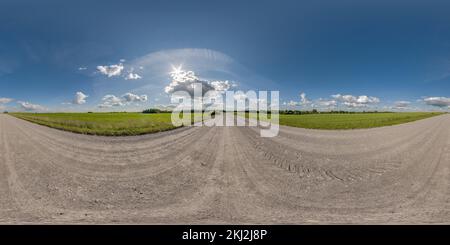 360 degree panoramic view of full seamless spherical hdri 360 panorama view on no traffic gravel road among fields with awesome clouds in equirectangular projection, may use like