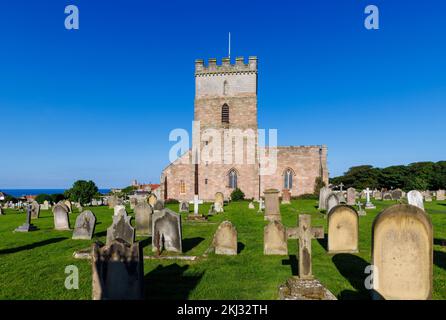 St Aidan's Church in Bamburgh, a village in Northumberland on the north-east coast of England, which contains the Monument to Grace Darling Stock Photo