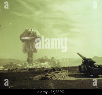 Project 30-18 - Operation Upshot/Knothole (Nevada Test Site) Detonation. GRABLE cloud, cannon in foreground. Photographs of Atmospheric Nuclear Testing at Pacific Island and Nevada Test Sites. Stock Photo