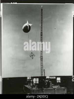 Project 26 - Operation Dominic (Johnston Island/Christmas Island/Maui, Hawaii) Test Activities. Airdrop target raft with service personnel aboard. Photographs of Atmospheric Nuclear Testing at Pacific Island and Nevada Test Sites. Stock Photo