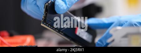 Installation of new RAM or processor of personal computer in service. Stock Photo