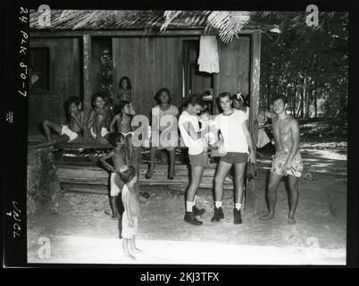 Project 24 - Operation Hardtack (Enewetak/Bikini/Johnnston Island Area) Test Activities. Villagers at Kusaie. Photographs of Atmospheric Nuclear Testing at Pacific Island and Nevada Test Sites. Stock Photo