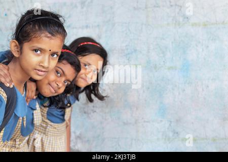 Group of School Girls peeping from a classroom Stock Photo