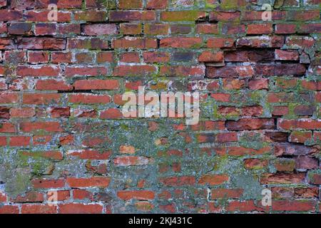 Abstract background wall of old crumbling red brick Stock Photo