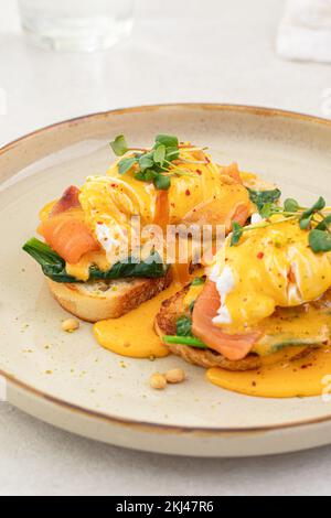 Portion of eggs benedict toast with salmon Stock Photo