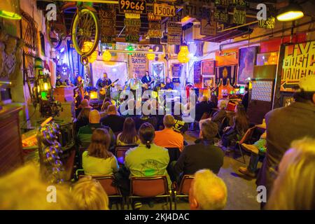 Bob Beru gestures onstage as he leads the band through a performance ...