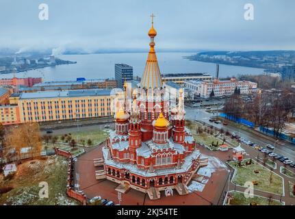 St. Michael the Archangel Cathedral. Aerial View. Beautiful cathedral with golden domes. The main architectural landmark of Izhevsk, Russia. Popular tourist destination. Izhevsk Pond in the background Stock Photo