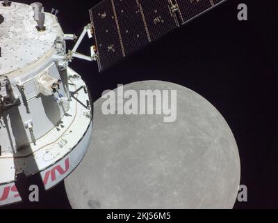 Earth Orbit, Earth Orbit. 21 November, 2022. Selfie of the Orion crew capsule during the nearest approach to the Moon in the lower right as it positions for a lunar flyby, on flight day six of the NASA Artemis I mission, November 21, 2022, in Earth Orbit. The image was captured by a camera on the tip of one of the solar arrays as it approached the moon.  Credit: NASA/NASA/Alamy Live News Stock Photo