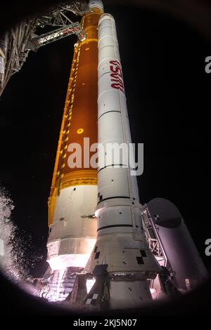 Kennedy Space Center, United States of America. 16 November, 2022. The massive super heavy-lift solid rocket boosters on the NASA Artemis I Space Launch System carrying the Orion spacecraft ignites as it prepares for blast off from launch pad 39B at the Kennedy Space Center, November 16, 2022, in Cape Canaveral, Florida. After several failed attempts the un-crewed flight test lifted off on the first test of the Deep Space Exploration mission.  Credit: Chris Coleman and Kevin Davis/NASA/Alamy Live News Stock Photo